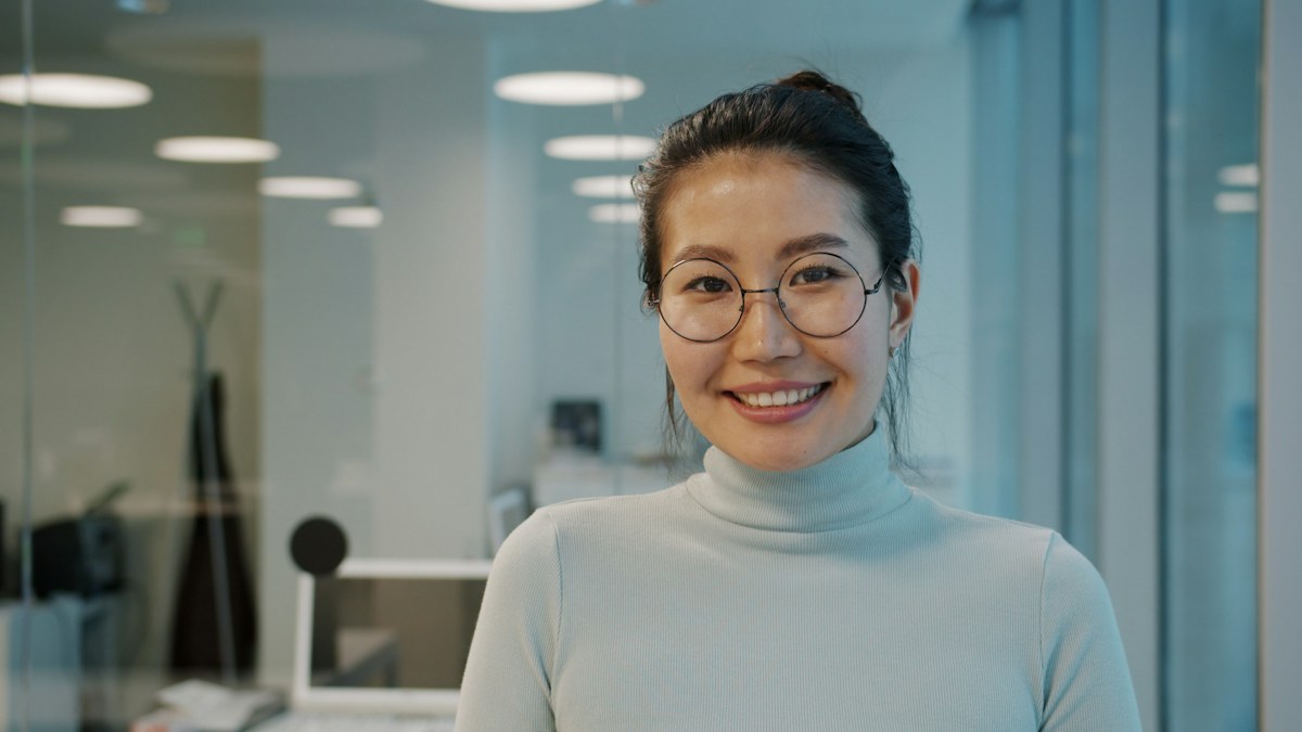 A smiling professional looking at the camera